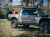 Rooftop awning attached to roof rails on a Toyota Tacoma truck