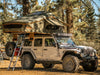 Vagabond XL Rooftop Tent in Forest Green Hyper Orange with telescopic ladder on a Jeep Rubicon